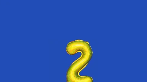 Foil balloon with number 2 moving across blue screen Stock Footage 315516013