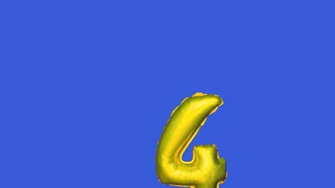Foil balloon with number 4 moving across blue screen Stock Footage 315516031
