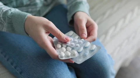 Foil blisters with tablets are in hands of unrecognizable. Stock Footage 304805509
