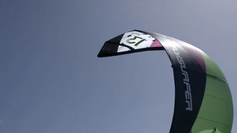 Foil kite flying in the blue sky Stock Footage 74908368