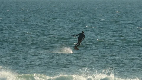 Foil surfing on the ocean in slow-motion Stock Footage 88283592