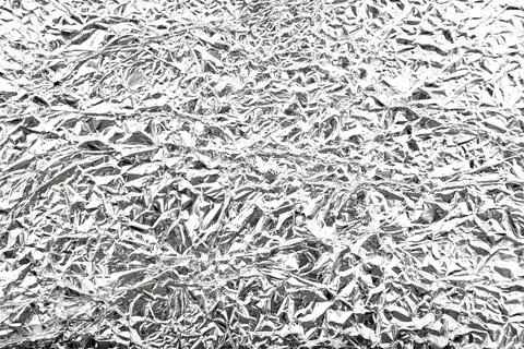 Foil texture. Background of crumpled foil closeup Stock Photos