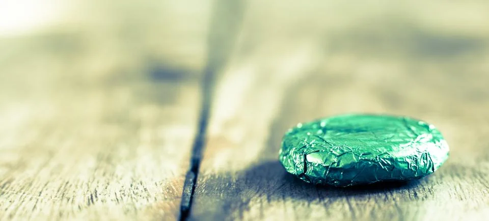 Foiled mint chocolates | Thin Mints | Mint Cream Packets Stock Photos