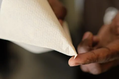 Fold the tip of the paper filter Stock Photos