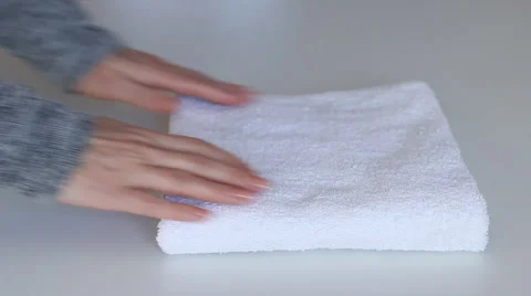 Fold towels on white table Stock Footage 59827608