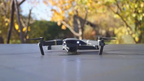 Foldable drone take off from the table, front view Stock Footage 97727487