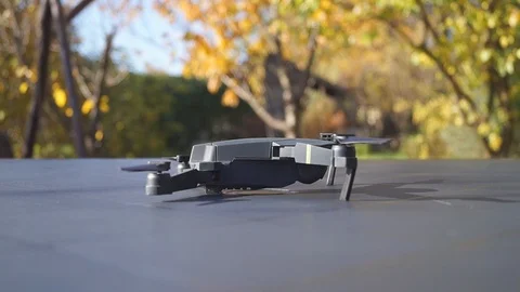 Foldable drone take off from the table, right view Stock Footage 97727432