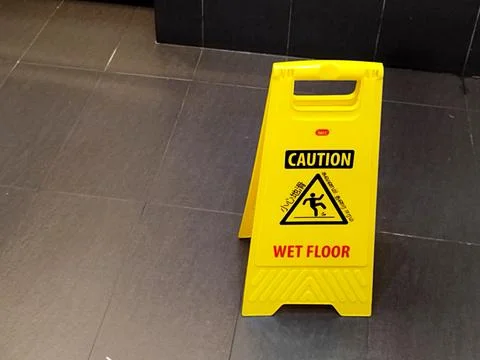 Foldable yellow plastic A-frame warning sign manufactured by iMec Stock Photos