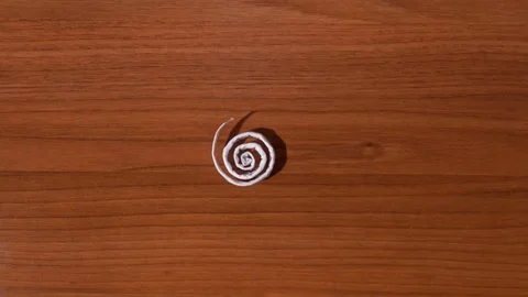 Folded A4 sheet of paper becomes straight Stock Footage 120314870