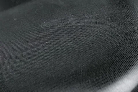 Folded Black Fabric Texture with Soft Shadows Stock Photos