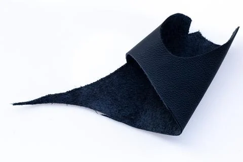 Folded Black Leather Sheet Showing Smooth and Suede Sides on White Backgrou.. Stock Photos