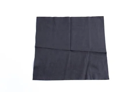 Folded black microfiber cleaning cloth for lenses isolated on white backgroun Stock Photos