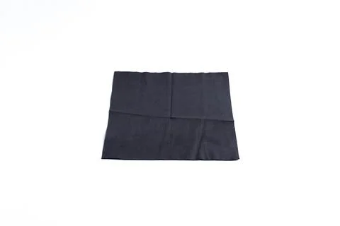 Folded black microfiber cleaning cloth for lenses isolated on white backgroun Stock Photos
