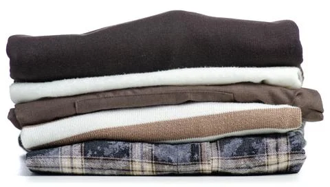 Folded brown white clothes stack Stock Photos