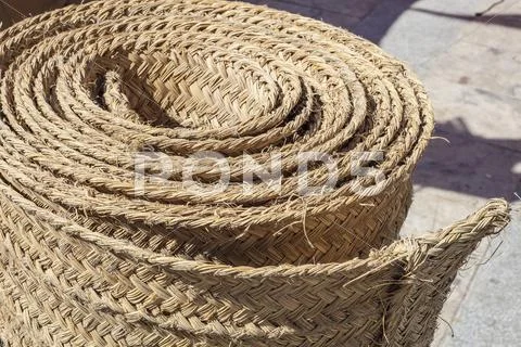Folded carpet made of esparto fibers Stock Photos
