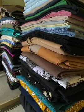 Folded clothes on the table Stock Photos