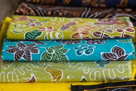 Folded Colorful Batik Cloth Stack on Display Rack for Background Stock Photos