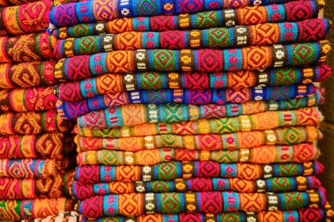 Folded colorful middle eastern carpets at bazaar Stock Photos