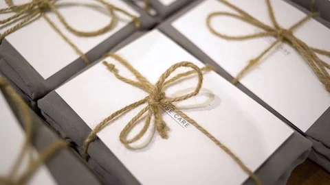 Folded Dresses on Table in Sunlight Stock Footage 104809307