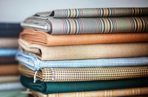 Folded fabrics in a neat stack Stock Photos