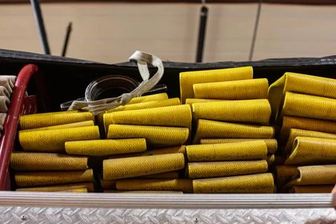 Folded fire hose on back of fire engine Foto stock