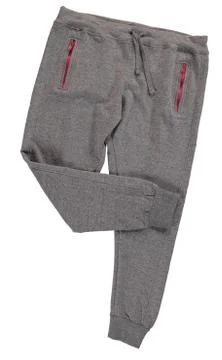 Folded gray jogging pants. Isolated image on a white background. Stock Photos