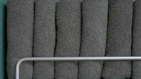 Folded gray towels in the closet close-up front view, space organization concept Stock Footage 266355252