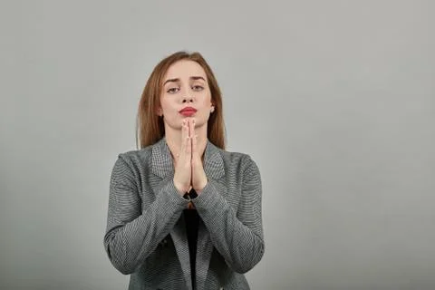 Folded hands together praying asking God help ask implore wish upwards Jesus Foto stock