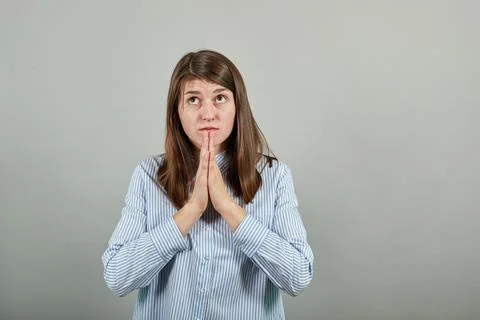 Folded hands together praying asking God help ask implore wish upwards Jesus Stock Photos
