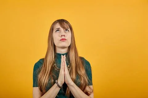 Folded hands together praying asking God help ask implore wish upwards Jesus Stock Photos