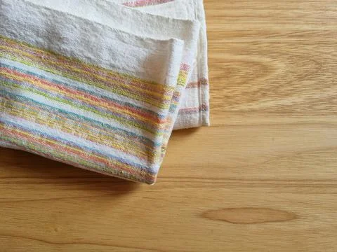 Folded kitchen towel on the table Stock Photos
