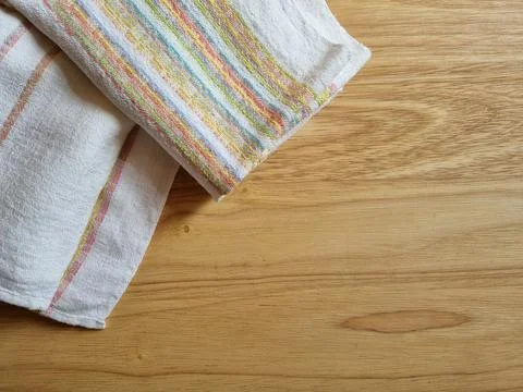 Folded kitchen towel on the table Stock Photos