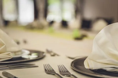Folded napkins on a dinner table Stock Photos