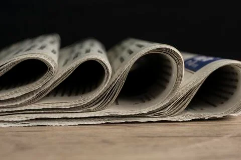 Folded newspapers lined up Stock Photos