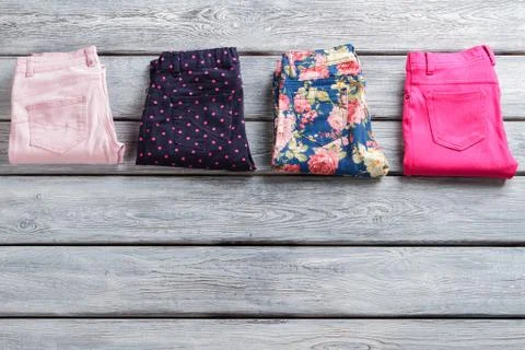 Folded pants of different color. Stock Photos