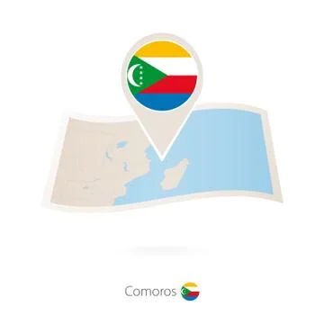 Folded paper map of Comoros with flag pin of Comoros. Stock Illustration