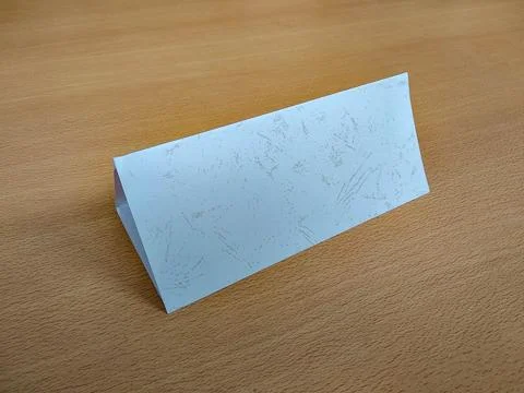Folded paper for nameplate on table Stock Photos