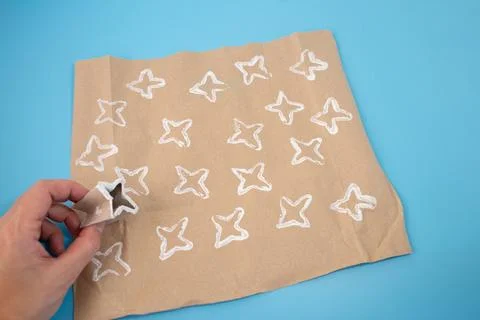 Folded paper roll into a star shape for DIY kids activity, perfect for maki.. Stock Photos