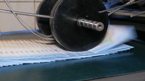 Folded paper under black roller 库存影片 65500620