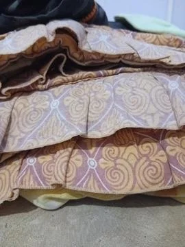 Folded Patterned Fabric Layers Close Up Foto stock