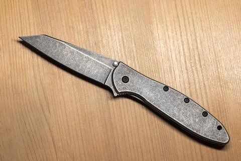 Folded pocket knife featuring stone washed steel parts by Kershaw Knives Photos