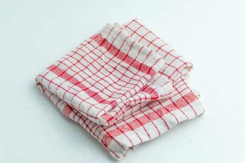Folded red and white checkered kitchen cloth napkin isolated on a white bac.. Stock Photos