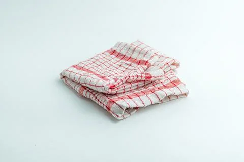 Folded red and white checkered kitchen cloth napkin isolated on a white bac.. Stock Photos