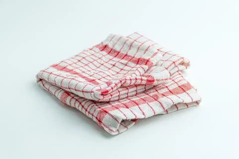 Folded red and white checkered kitchen cloth napkin isolated on a white bac.. Stock Photos