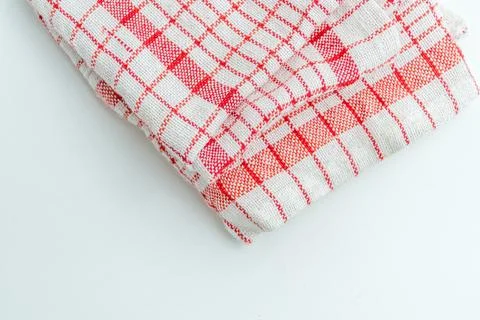 Folded red and white checkered kitchen cloth napkin isolated on a white bac.. Stock Photos