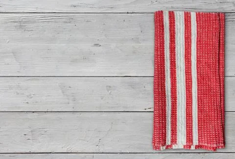 Folded red napkin on table Stock Photos