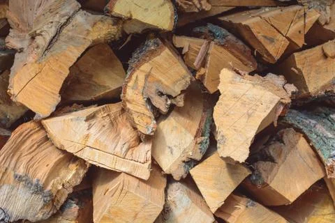 Folded sawn trunks of trees with bark Stock Photos