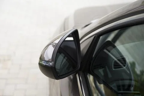 Folded side view car mirror placed on the exterior Stock Photos