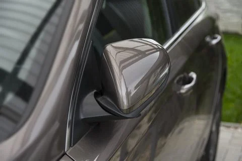 Folded side view car mirror placed on the exterior Stock Photos