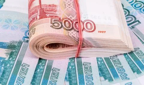 Folded stack of five thousandths banknotes of russian roubles on money backgr Stock Photos